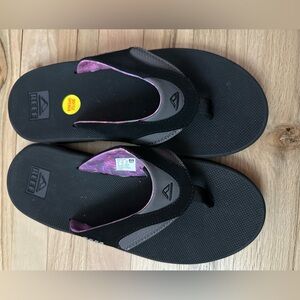 New - Women’s Reef Sandals with bottle opener size 12.